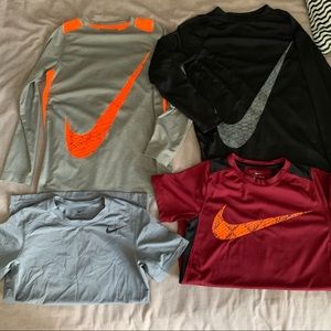 4 Nike dry fit tops YM . 2 long sleeve/ 2 short